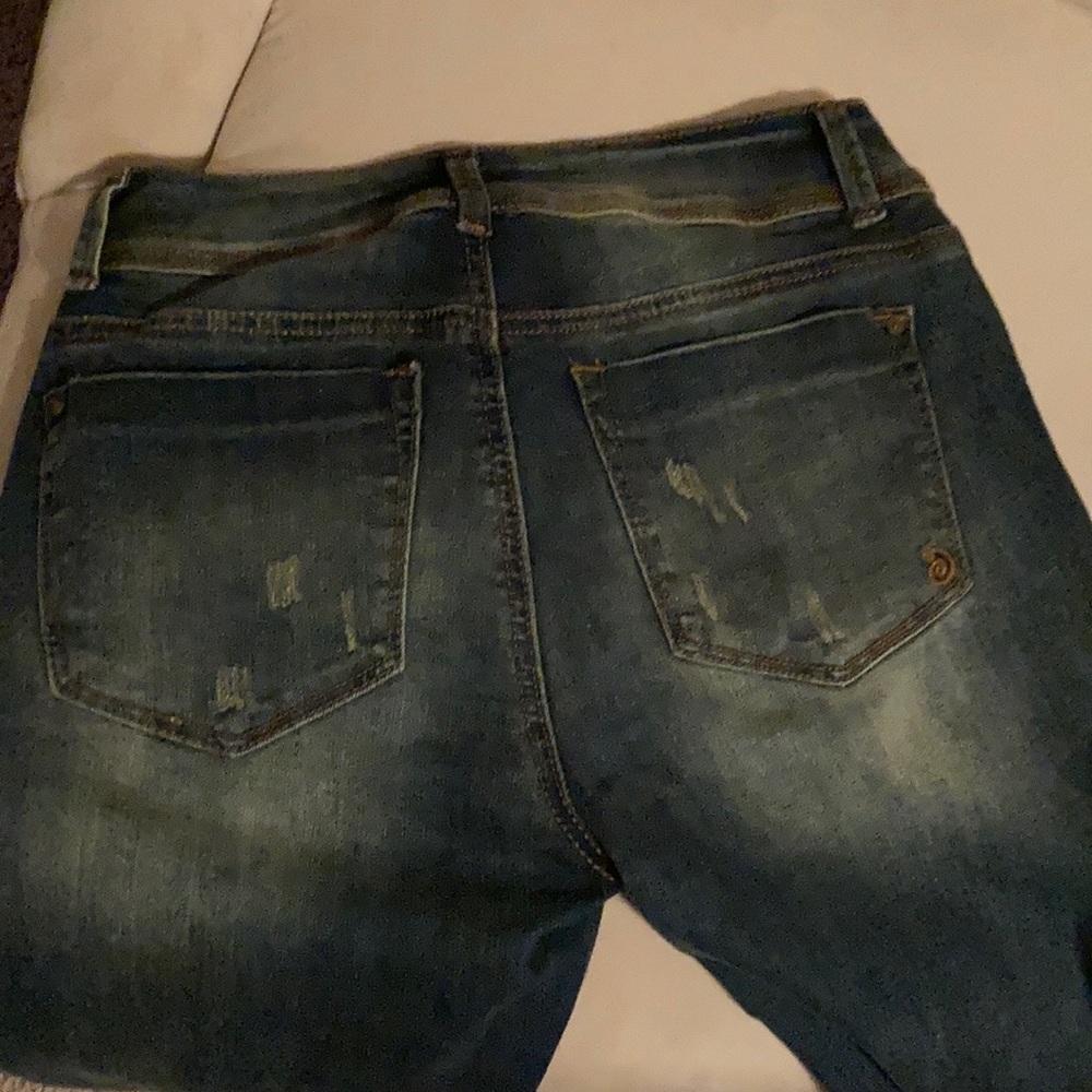Sustain Mid Rise Distressed Jeans